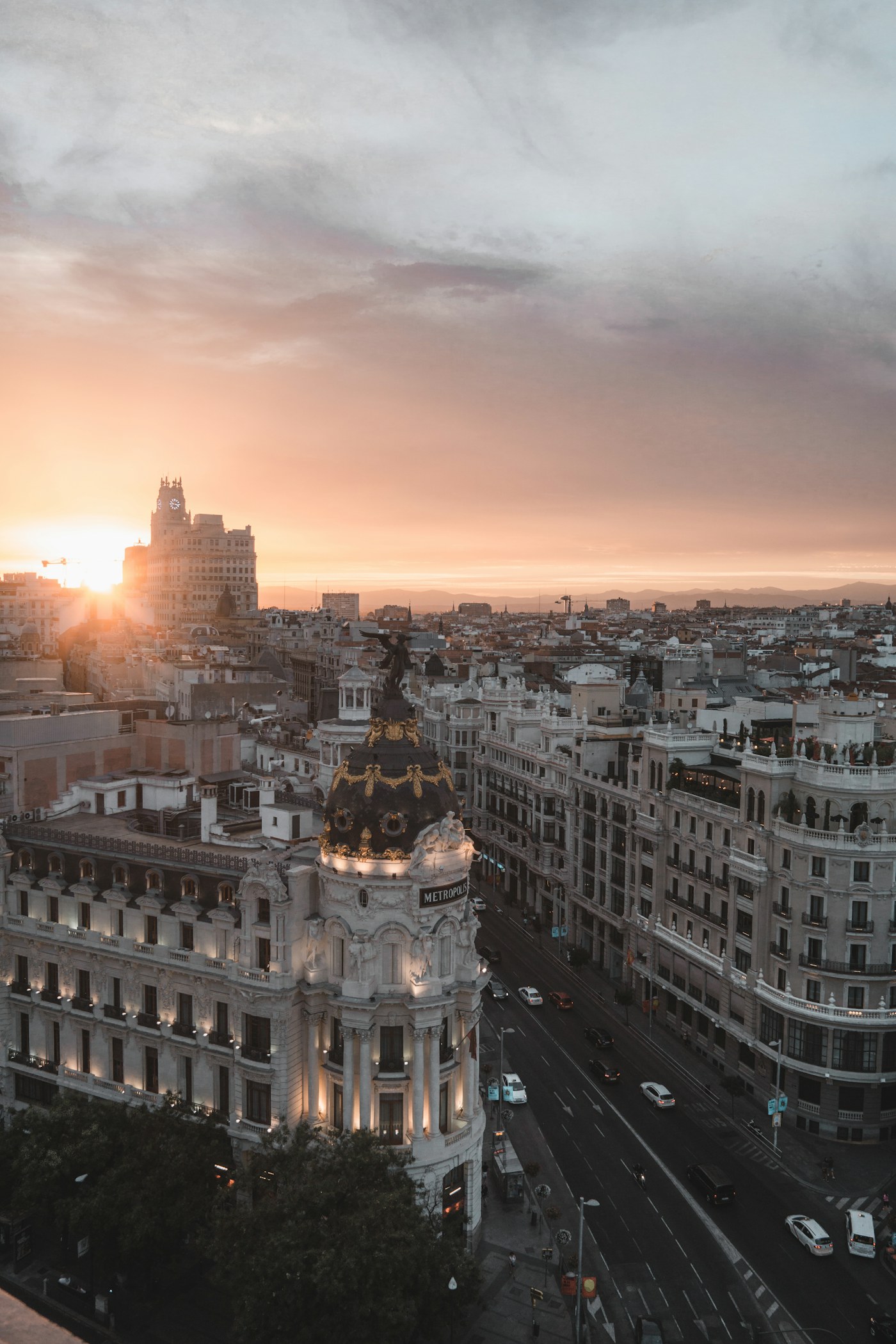 Madrid rooftops and the Metropolis building at sunset