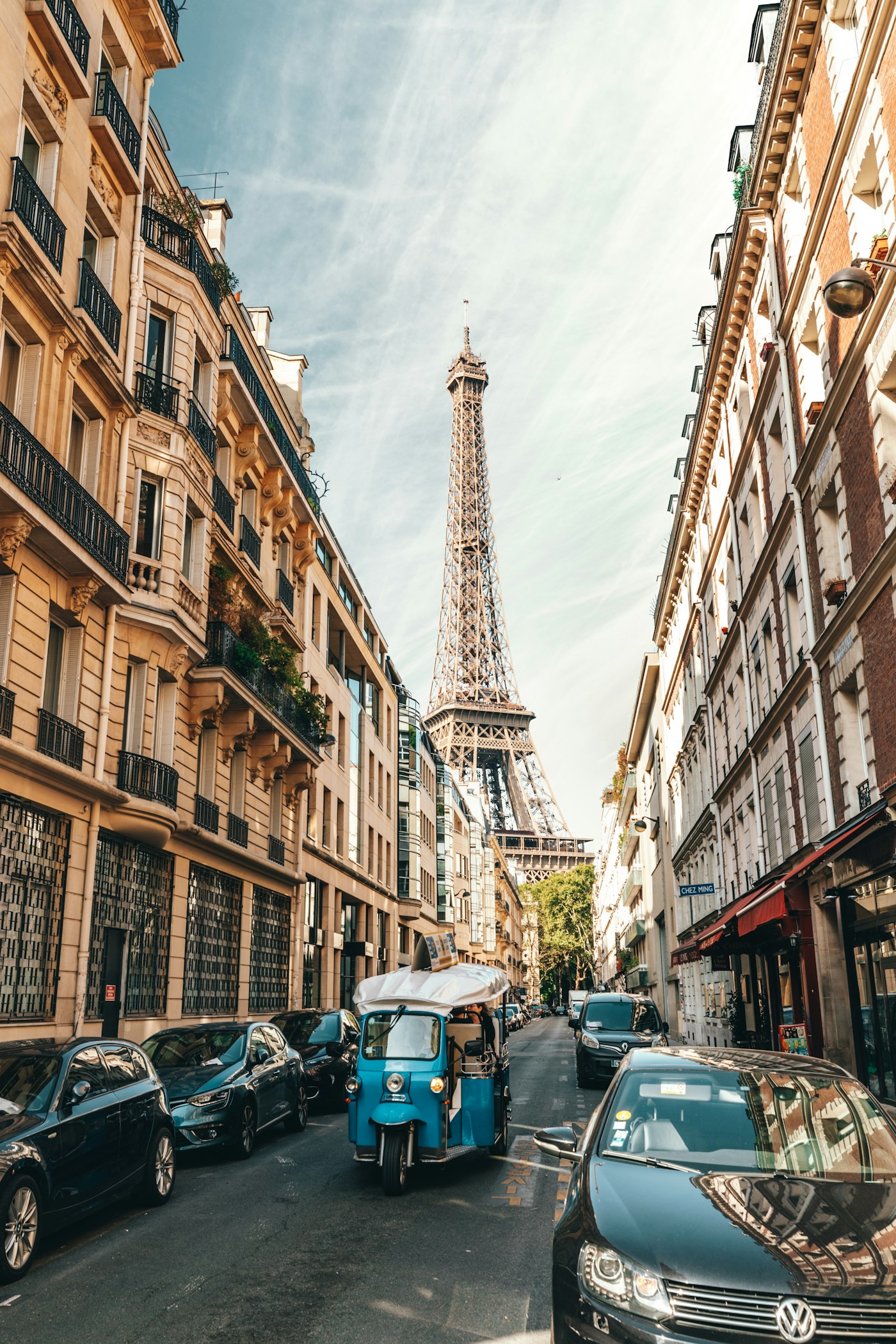 A Paris street with the Eiffel Tower in the distance