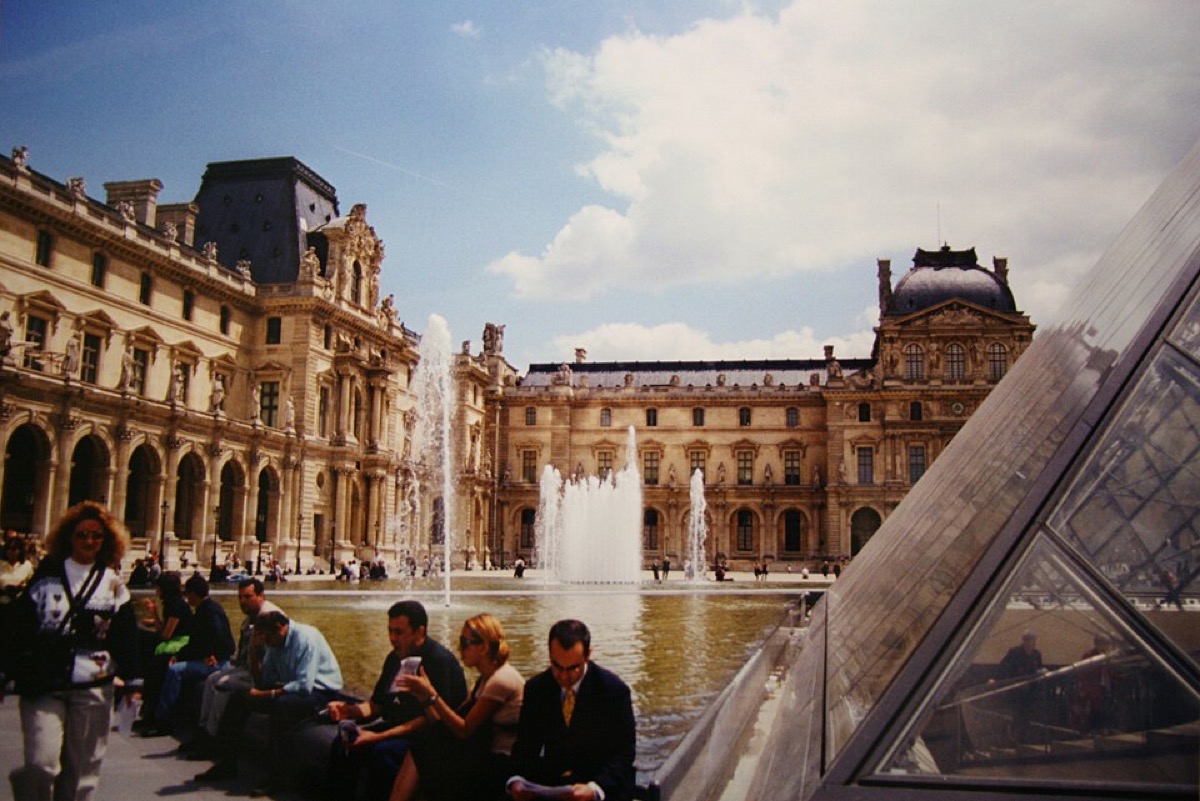 Visitors in the Louvre courtyard