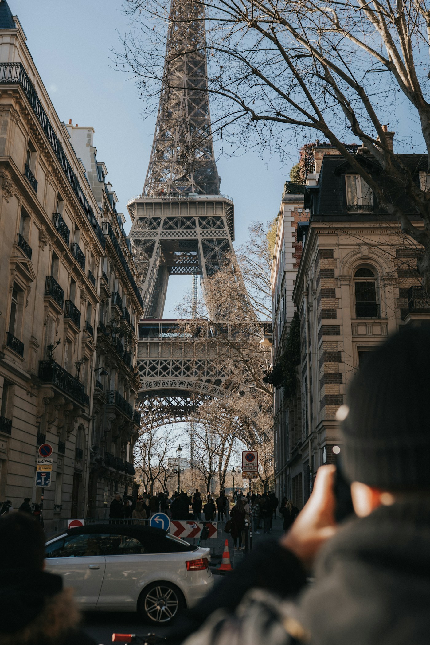 Visitors on a street near the Eiffel Tower