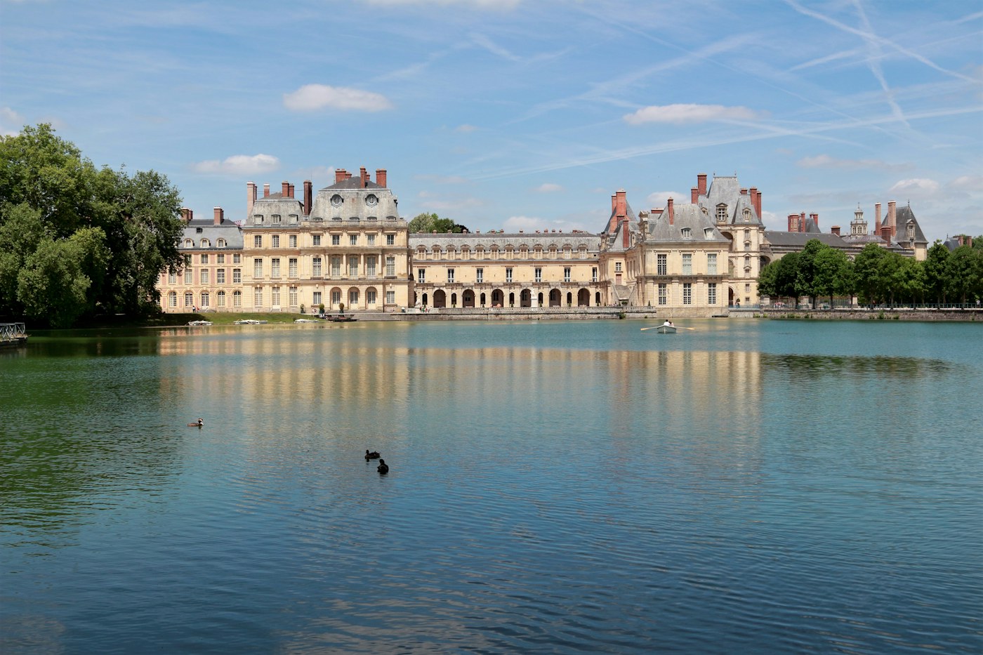 Chateau de Fontainebleau beside its pond in summer