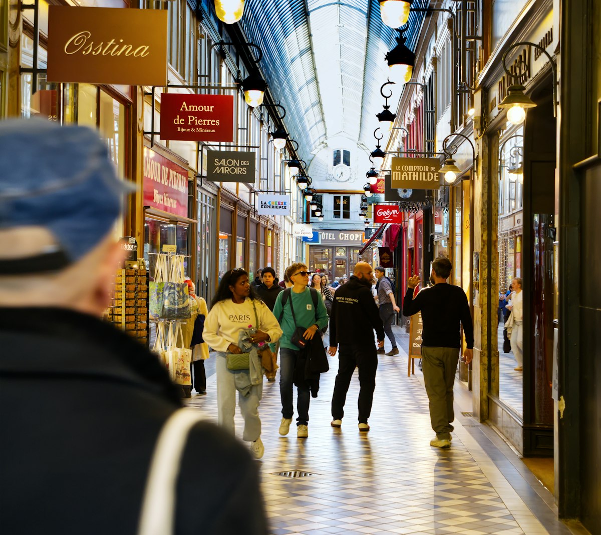 Shops beneath the glass roof of Passage Jouffroy