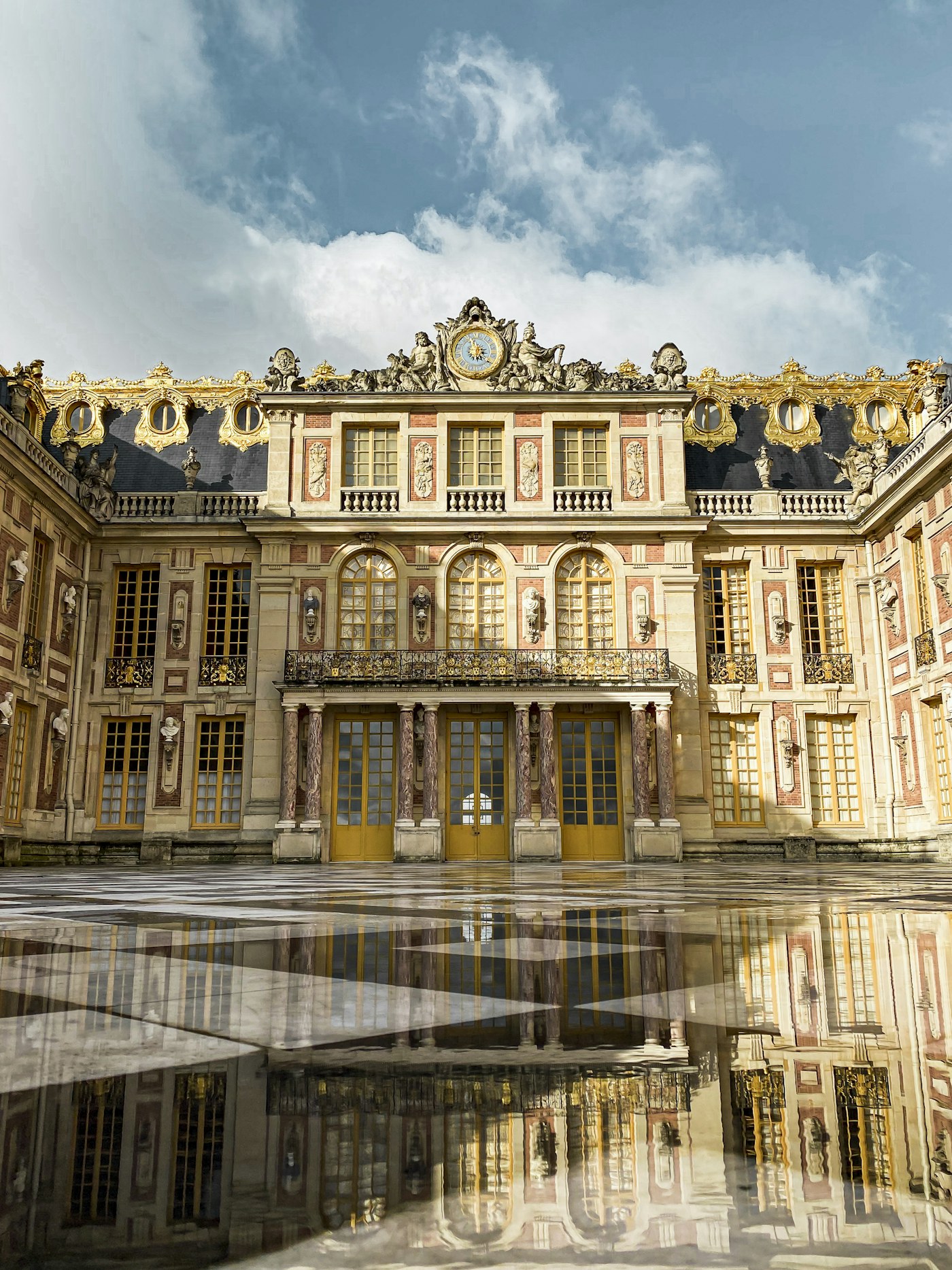 Wet marble paving in the Versailles courtyard
